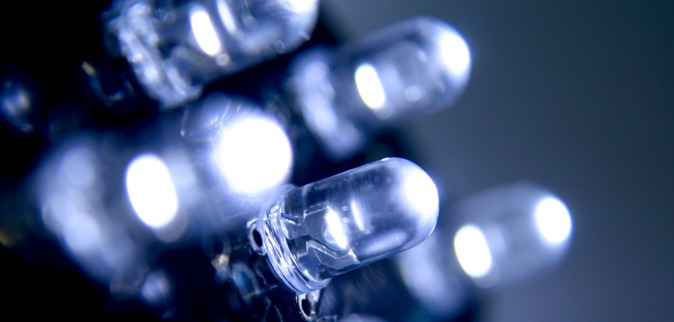 LED, Solid State Lighting. Electronics industry LED lightbulbs in rows. White and blue.